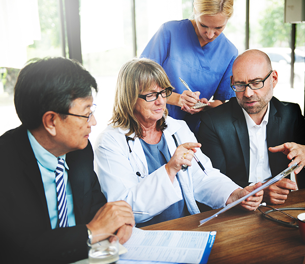 Group of medical professionals discusses clinical trials