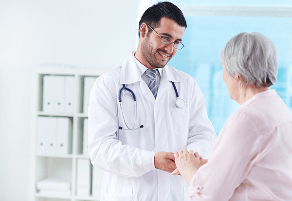 Doctor talking to elderly patient