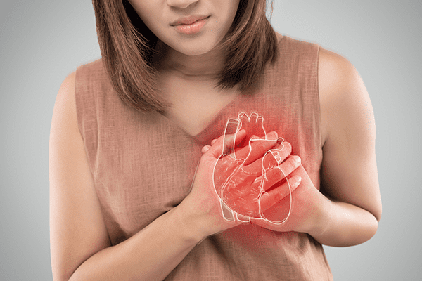 Girl holding hands over heart