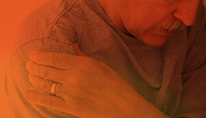 Elderly Lady Holding Shoulder