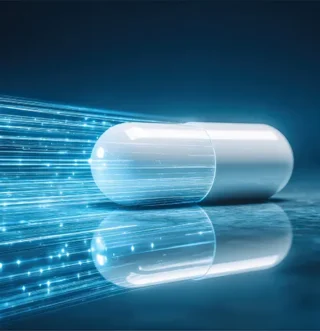 White pharmaceutical capsule on a reflective surface with streaks of blue light